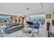 Open concept living room with modern furniture and pool view at 6231 Beechwood Ave, Sarasota, FL 34231