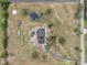 Aerial view of a house on a large lot with a pond at 639 Oakford Rd, Sarasota, FL 34240