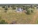 Aerial view of a farmhouse with large lot and pond at 639 Oakford Rd, Sarasota, FL 34240