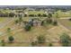 Aerial view showing a large farmhouse on a spacious lot with a long driveway at 639 Oakford Rd, Sarasota, FL 34240