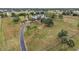 Aerial view of a farmhouse with a large yard and long driveway at 639 Oakford Rd, Sarasota, FL 34240