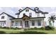 Farmhouse exterior with large front porch and double doors at 639 Oakford Rd, Sarasota, FL 34240