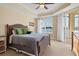 Spacious bedroom with lake view and access to balcony at 6474 Watercrest Way # 202, Lakewood Ranch, FL 34202