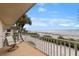 Beachfront balcony view and seating at 6701 Gulf Of Mexico Dr # 317, Longboat Key, FL 34228