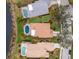 Birds-eye view of houses with pools near a lake at 6726 Virginia Xing, University Park, FL 34201