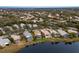 Aerial view of a neighborhood with lakefront properties at 6726 Virginia Xing, University Park, FL 34201