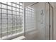 Bathroom with glass block window and shower at 6726 Virginia Xing, University Park, FL 34201
