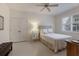 Bedroom with double doors and window at 6726 Virginia Xing, University Park, FL 34201