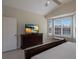 Bright bedroom with large window, dresser, and TV at 6726 Virginia Xing, University Park, FL 34201