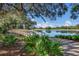 Scenic wooden bridge over a tranquil pond, surrounded by lush greenery at 6726 Virginia Xing, University Park, FL 34201