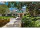 Elegant clubhouse entrance with landscaping and a bridge at 6726 Virginia Xing, University Park, FL 34201
