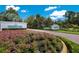 University Park community entrance with a landscaped median at 6726 Virginia Xing, University Park, FL 34201