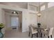 Elegant dining area with a round glass table and four chairs at 6726 Virginia Xing, University Park, FL 34201