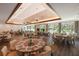 Elegant dining room with large windows and modern chandeliers at 6726 Virginia Xing, University Park, FL 34201