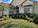 House exterior showcasing a well-manicured lawn and hedges at 6726 Virginia Xing, University Park, FL 34201