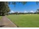 Expansive green golf course with players and carts visible at 6726 Virginia Xing, University Park, FL 34201