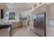 Bright kitchen with stainless steel appliances and granite countertops at 6726 Virginia Xing, University Park, FL 34201