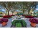 Landscaped courtyard with lush plants and walking path at 6726 Virginia Xing, University Park, FL 34201