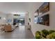 Spacious living room with high ceilings, tile floor, and view of pool at 6726 Virginia Xing, University Park, FL 34201