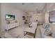 Bright living room with vaulted ceilings, comfortable seating, and large windows at 6726 Virginia Xing, University Park, FL 34201