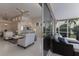 Open living room with access to a screened patio at 6726 Virginia Xing, University Park, FL 34201