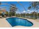Sparkling screened pool with lake view at 6726 Virginia Xing, University Park, FL 34201