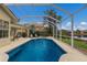 Enjoy this screened pool with a lake view at 6726 Virginia Xing, University Park, FL 34201