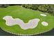Aerial view of a sand trap next to a lake at 6726 Virginia Xing, University Park, FL 34201