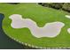 Aerial view of a sand trap next to a lake at 6726 Virginia Xing, University Park, FL 34201