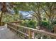 Wooden deck pathway leads to community clubhouse at 6726 Virginia Xing, University Park, FL 34201
