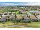 Community overview featuring numerous homes and tranquil ponds at 6933 Quiet Creek Dr, Bradenton, FL 34212