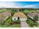 Aerial view of single-Gathering home with tile roof and golf course views at 6933 Quiet Creek Dr, Bradenton, FL 34212