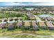 Aerial view of community with houses, landscaping, and waterways at 6933 Quiet Creek Dr, Bradenton, FL 34212