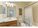 Clean bathroom with a shower/tub combo and updated vanity at 6933 Quiet Creek Dr, Bradenton, FL 34212