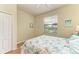 Bedroom with a queen bed and window view at 6933 Quiet Creek Dr, Bradenton, FL 34212