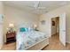 Main bedroom with ceiling fan and ensuite bathroom at 6933 Quiet Creek Dr, Bradenton, FL 34212