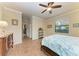 Spacious bedroom with wood flooring and access to hallway at 6933 Quiet Creek Dr, Bradenton, FL 34212