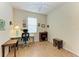 Bright bedroom with a home office setup and wood flooring at 6933 Quiet Creek Dr, Bradenton, FL 34212