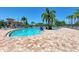 Resort-style pool with lounge chairs and umbrellas at 6933 Quiet Creek Dr, Bradenton, FL 34212
