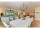 Open concept dining room with view of the living room and kitchen at 6933 Quiet Creek Dr, Bradenton, FL 34212