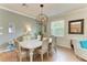Dining room with chandelier, large table, and hardwood floors at 6933 Quiet Creek Dr, Bradenton, FL 34212