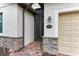Front entrance with a security screen door and brick walkway at 6933 Quiet Creek Dr, Bradenton, FL 34212