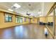 Spacious exercise room with wood flooring and large mirrors at 6933 Quiet Creek Dr, Bradenton, FL 34212