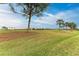 Landscaped golf course with mature trees at 6933 Quiet Creek Dr, Bradenton, FL 34212