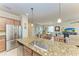 Modern kitchen features stainless steel appliances and granite countertops at 6933 Quiet Creek Dr, Bradenton, FL 34212