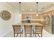 Modern kitchen with granite countertops, stainless steel appliances, and an island with seating at 6933 Quiet Creek Dr, Bradenton, FL 34212