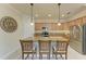 Modern kitchen with granite countertops, stainless steel appliances, and an island with seating at 6933 Quiet Creek Dr, Bradenton, FL 34212