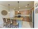 Kitchen with island, stainless steel appliances, and granite countertops at 6933 Quiet Creek Dr, Bradenton, FL 34212
