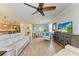 Bright living room with hardwood floors, comfortable seating, and open floor plan at 6933 Quiet Creek Dr, Bradenton, FL 34212
