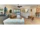 Bright and airy living room with hardwood floors and patio access at 6933 Quiet Creek Dr, Bradenton, FL 34212